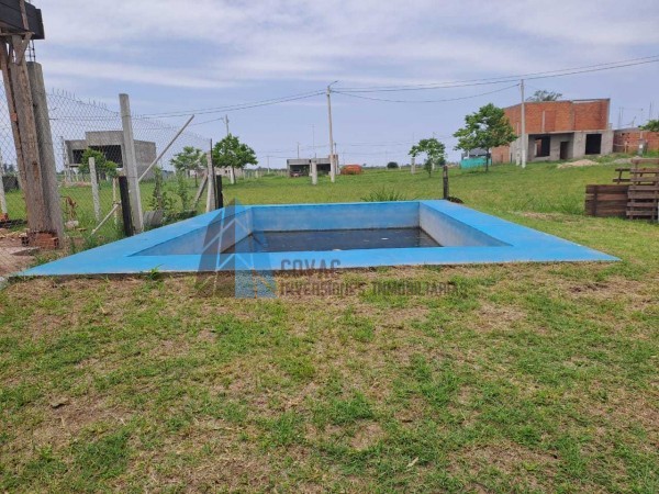 CASA 3 DORMITORIOS BARRIO PRIVADO LOMA ALTA